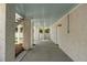 Under the house covered patio with concrete floor, multiple pillars, and a light blue ceiling at 14 55Th Ave, Isle of Palms, SC 29451
