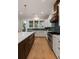 Bright kitchen with a large island, modern appliances, and backyard views at 14 55Th Ave, Isle of Palms, SC 29451