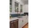 Close-up of kitchen with designer tile backsplash, stainless appliances, and under-mount sink at 14 55Th Ave, Isle of Palms, SC 29451