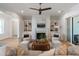 Bright living room with fireplace, built in shelving, and neutral tones at 14 55Th Ave, Isle of Palms, SC 29451