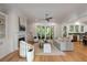Open concept living room with fireplace, hardwood floors, and access to outdoor patio at 14 55Th Ave, Isle of Palms, SC 29451