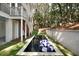 Backyard view of the home's rectangle pool and patio featuring manicured grass at 14 55Th Ave, Isle of Palms, SC 29451
