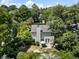 Aerial view of the home featuring the backyard patio, grill, furniture, mature trees, and more at 1406 Oaklanding Rd, Mount Pleasant, SC 29464