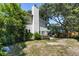 View of a backyard featuring mature trees, patio, grill, furniture, and a view of the home at 1406 Oaklanding Rd, Mount Pleasant, SC 29464
