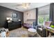 Modern Bedroom with dark accent wall, crib, changing table, and cozy gray rocking chair at 1406 Oaklanding Rd, Mount Pleasant, SC 29464