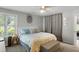 Bright bedroom features neutral walls, a lion wall hanging, a large bed and a storage ottoman at 1406 Oaklanding Rd, Mount Pleasant, SC 29464