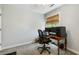 Bright bedroom with a computer desk, ergonomic chair and natural light from a large window at 1406 Oaklanding Rd, Mount Pleasant, SC 29464