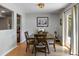 Cozy dining area features wooden furniture, complemented by hardwood flooring and a door leading outside at 1406 Oaklanding Rd, Mount Pleasant, SC 29464