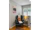 Inviting hallway nook with comfortable blue armchair, accent table, and natural light at 1406 Oaklanding Rd, Mount Pleasant, SC 29464