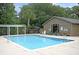 Community swimming pool with lifeguard chair, set among lush greenery for relaxation and recreation at 1406 Oaklanding Rd, Mount Pleasant, SC 29464