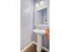 Picture of a powder room with a pedestal sink, white fixtures, and a decorative mirror at 142 Airy Dr, Summerville, SC 29486