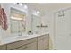 Stylish bathroom with double sinks, modern fixtures, and a glass-enclosed shower at 142 Airy Dr, Summerville, SC 29486