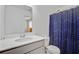Bathroom showcasing a vanity with a sink, a toilet, and a shower with a blue patterned curtain at 142 Airy Dr, Summerville, SC 29486