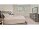 Bright bedroom with a cozy bed, neutral tones, dresser and natural light from the window at 142 Airy Dr, Summerville, SC 29486
