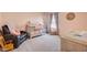 Charming Bedroom with pink walls, a crib, a rocking chair, a recliner, and soft carpet flooring at 142 Airy Dr, Summerville, SC 29486