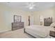 Bright Primary bedroom with a cozy bed, neutral tones, and natural light from the windows at 142 Airy Dr, Summerville, SC 29486