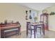Inviting dining area featuring a decorative cabinet, flowers, guitars, and a piano at 142 Airy Dr, Summerville, SC 29486