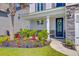 Inviting front porch with a beautifully landscaped yard at 142 Airy Dr, Summerville, SC 29486