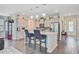 Open-concept kitchen featuring a large island, stainless steel appliances, and pendant lighting at 142 Airy Dr, Summerville, SC 29486