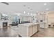 Bright kitchen with stainless appliances, island with bar seating, and open to the living room at 142 Airy Dr, Summerville, SC 29486