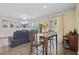 Open-concept living area featuring a fireplace, tv, sliding doors, and adjacent dining area at 142 Airy Dr, Summerville, SC 29486