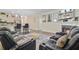 Open-concept living area with fireplace, TV, adjacent kitchen, and leather reclining sofa at 142 Airy Dr, Summerville, SC 29486