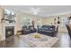 Comfortable living room featuring a fireplace, plush seating, and hardwood floors at 142 Airy Dr, Summerville, SC 29486
