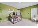 A home office with a large desk, a faux fur chair, and plants at 142 Airy Dr, Summerville, SC 29486