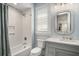 A charming bathroom with white subway tile in the shower and a gray vanity at 1491 Tomato Farm Cir, Mount Pleasant, SC 29464