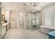 Bright bathroom featuring a glass shower, soaking tub, double vanity, and neutral tile flooring at 1491 Tomato Farm Cir, Mount Pleasant, SC 29464