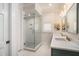 Modern bathroom featuring a glass enclosed shower, marble countertop, and plantation shutters at 1491 Tomato Farm Cir, Mount Pleasant, SC 29464