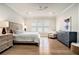 Serene bedroom with a neutral color palette, hardwood floors, and ample natural light at 1491 Tomato Farm Cir, Mount Pleasant, SC 29464
