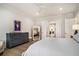 Airy bedroom featuring hardwood floors, neutral decor, and a view into the hallway at 1491 Tomato Farm Cir, Mount Pleasant, SC 29464