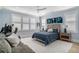 Calm bedroom with a blue accent wall, plush gray sofa, and two bedside tables at 1491 Tomato Farm Cir, Mount Pleasant, SC 29464