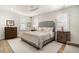 Neutral bedroom featuring hardwood floors and two bedside tables at 1491 Tomato Farm Cir, Mount Pleasant, SC 29464
