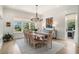 Elegant dining room with wood floors, large windows, and stylish decor at 1491 Tomato Farm Cir, Mount Pleasant, SC 29464