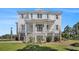 Charming two-story home featuring a welcoming front porch and classic architectural details at 1491 Tomato Farm Cir, Mount Pleasant, SC 29464