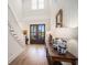 Bright foyer with wood floors, a staircase, and a console table with decor at 1491 Tomato Farm Cir, Mount Pleasant, SC 29464