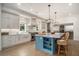 This spacious kitchen has modern appliances, custom cabinets, and a large island with bar seating at 1491 Tomato Farm Cir, Mount Pleasant, SC 29464