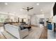 Spacious living room open to kitchen with fireplace and lots of natural light at 1491 Tomato Farm Cir, Mount Pleasant, SC 29464