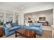 Cozy living room with comfortable seating, hardwood floors, and seamless flow to the office at 1491 Tomato Farm Cir, Mount Pleasant, SC 29464