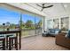 Screened porch offering views, comfortable seating, and outdoor dining setup at 1491 Tomato Farm Cir, Mount Pleasant, SC 29464