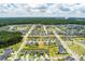 Panoramic aerial view of a well-planned community with homes, ponds, and green spaces at 160 Greenbelt Ct, Summerville, SC 29485