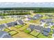 Aerial view of a community showcasing neatly arranged homes, lush green spaces, and serene pond at 160 Greenbelt Ct, Summerville, SC 29485