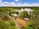 Aerial view of lakeside community featuring homes, lake access, and outdoor amenities at 160 Greenbelt Ct, Summerville, SC 29485