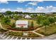 Well-manicured community entrance featuring lush landscaping, signage, and charming architecture, creating curb appeal at 160 Greenbelt Ct, Summerville, SC 29485