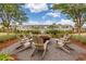 A cozy fire pit area with Adirondack chairs creates an inviting gathering space for residents to relax and socialize at 160 Greenbelt Ct, Summerville, SC 29485