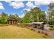 Community lake area featuring covered seating, kayak storage, and lake access at 160 Greenbelt Ct, Summerville, SC 29485