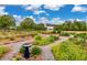 Scenic view of a meticulously maintained community garden with walking paths at 160 Greenbelt Ct, Summerville, SC 29485