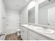 This full bath features double sinks, a large mirror and a shower-tub combination at 166 Rosefield Ct, Summerville, SC 29485